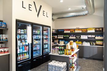 A store with a level sign on the wall and a variety of products on the shelves.